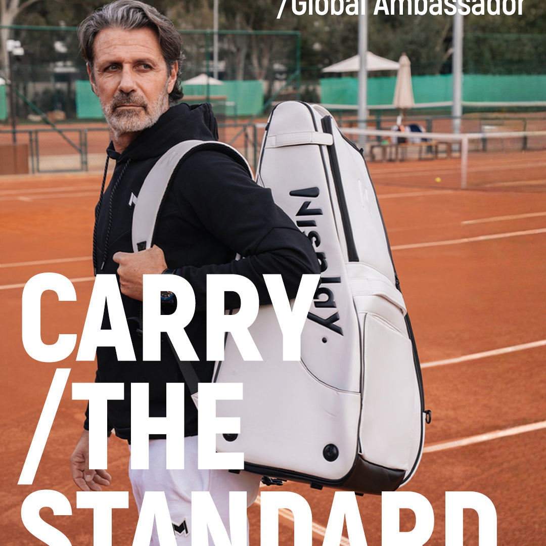Patrick Mouratoglou carrying the Nisplay Y1 portable tennis ball machine